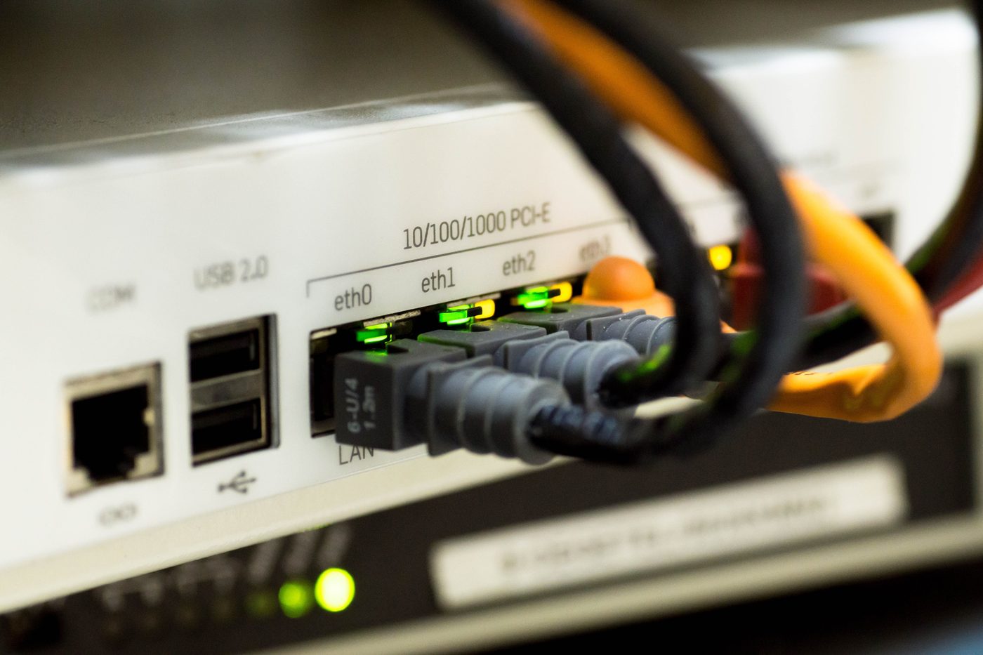Network cables plugged into a business router